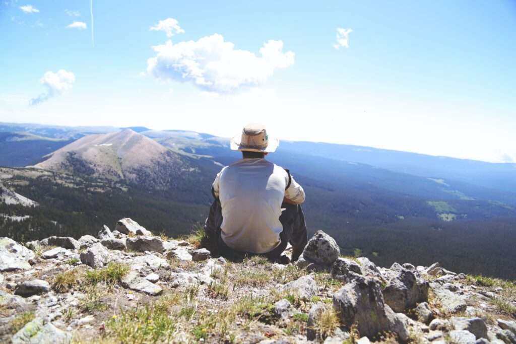 Man Sitting in the Mountains